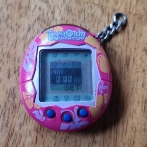 Tamagotchi Connection V2 Virtual Pet In a Pink and Yellow Hibiscus Flower Design